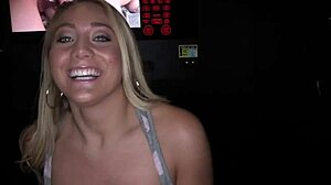 Gloryhole babe with small tits masturbates while sucking cock in close up