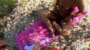 Seductress performs striptease by the lake at sunset