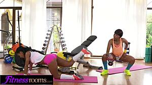 Ebony lesbians Sade Rose and Isabella Chrystin finger big asses in gym.