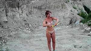 naked mature milf wife playing with soap bubbles outdoors