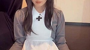 Beautiful Japanese ladyboy in nurse costume masturbates quietly