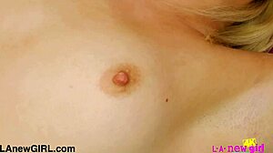 Dashing blonde model caresses her body during photoshoot