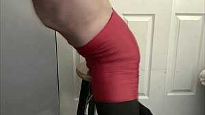 bodybuilder grinds on stool in black tights and red shorts while flashing underwear
