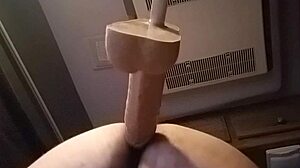 She's bent over in doggystyle, using huge dildo solo for intense pleasure in private