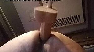 She's bent over in doggystyle, using huge dildo solo for intense pleasure in private