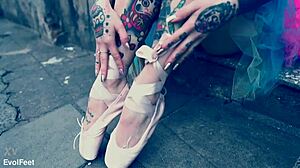 Why is this ballerina in ballet shoes strolling down the street?