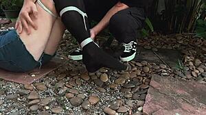 I punished her by tickling her feet outdoors