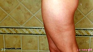 Captivating blonde model feels relaxed after photoshoot shower