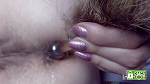Hairy toy penetrates hairy ass with silent farting