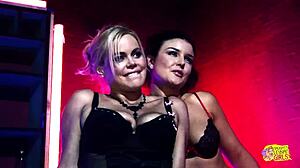 Two horny sluts watch a striptease and decide to fuck the stripper with a strapon