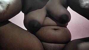 This Indian aunty with huge saggy tits fucks openly in front of everyone!