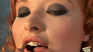 after double penetration, this redhead gets a bukkake over her face. what next?