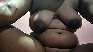 This Indian aunty with huge saggy tits fucks openly in front of everyone!