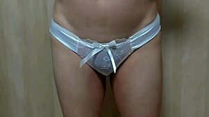 Japanese amateur plays anal in schoolgirl uniform, shorts, and see-through underwear.