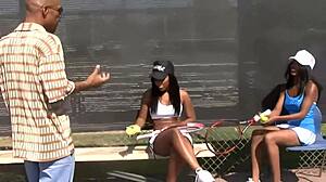 two black milfs are having a casual chat in a group on the bed