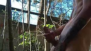 This athletic Brazilian nerd dominates a skinny tattooed guy with cum in the public garden toilet full scene