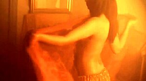 i love those moments when she dances naked, feeling free and exotic, her brunette hair flowing as she strips slowly in soft light.