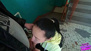 girl next door gives risky blowjob on public staircase for swallow