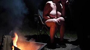 Naked beauty in the forest indulges in outdoor pleasure