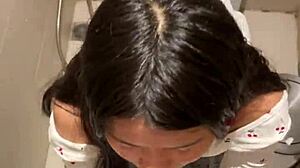 In public restroom, 18-year-old asian girl gives blowjob ending in huge cumshot