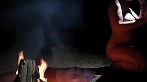 Naked beauty in the forest indulges in outdoor pleasure