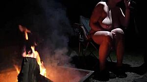 Naked beauty in the forest indulges in outdoor pleasure