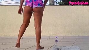 brunette trains outdoors with shorts up her ass