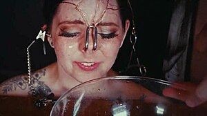 emo bondage whore gets face tied and punished with piss in garage