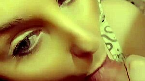 Redhead milf eagerly sucking on a throbbing hard cock in close-up view.