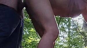 She sucks his cock in the forest while amused by honking