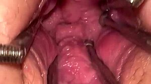 Watch the fist queen get her pussy stretched with a metal ring in this extreme session!