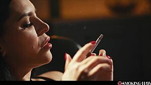 Hot brunette teases with handjob while smoking 😏.