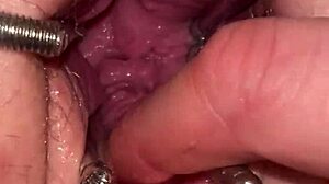 Watch the fist queen get her pussy stretched with a metal ring in this extreme session!