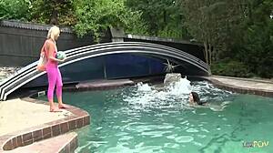 playful lesbian teens play at the pool