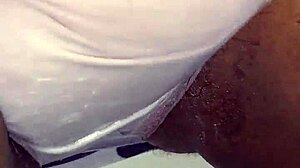 Ebony woman rubs her wet creamy pussy