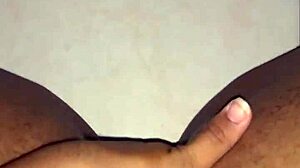 Ebony woman rubs her wet creamy pussy