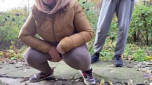 Curvy milf squats and pisses outdoors