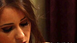 The horny lesbian madame deeply fingers pussy while kissing passionately.