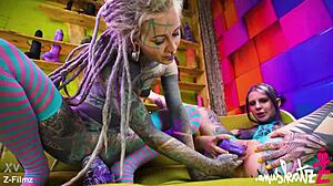 these two tattooed lesbians are having anal fun with big toys, gaping and orgasming.