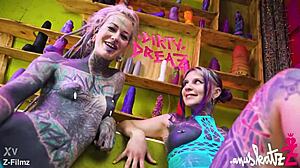 these two tattooed lesbians are having anal fun with big toys, gaping and orgasming.