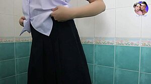 Horny student touches herself in bathroom