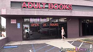 Teen sucks big black cock through gloryhole for facial cumshot