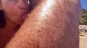 African teases huge cock blowjob on beach