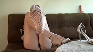 hot dirty girl in heels and stockings caresses her legs