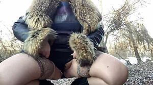 mature busty woman in stockings and dress relieves herself outdoors