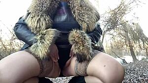 mature busty woman in stockings and dress relieves herself outdoors