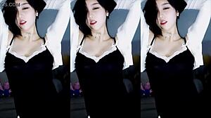 chinese girl dances sensually in traditional outfit