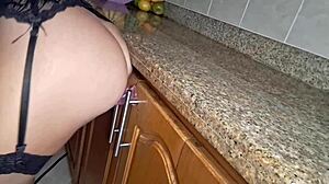 Maid gets hot cleaning kitchen, fingers pussy to orgasm