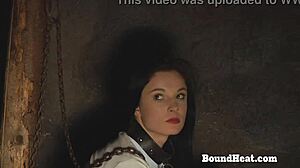 Gagged lesbian slave endures whipping from dominant madame