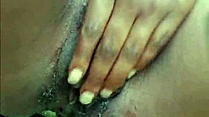 Horny ebony woman pisses publicly in wet outdoor spot